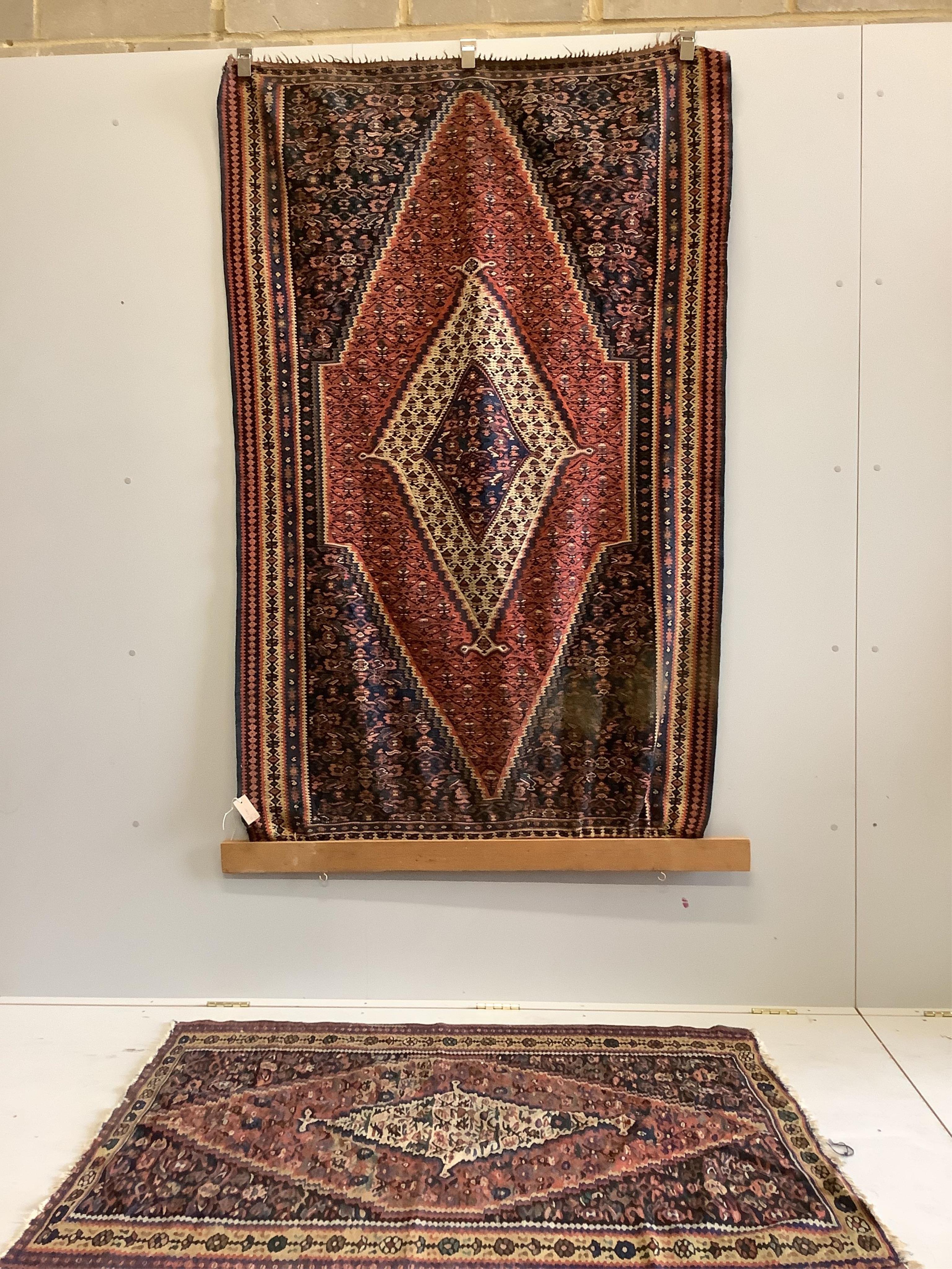 A near pair of antique Persian Senneh flatweave rugs, approximately 180 x 124cm. Condition - fair